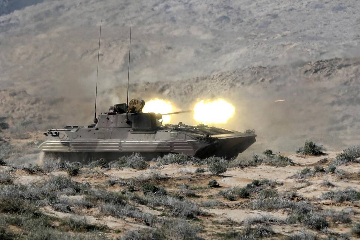 An armoured fighting vehicles opens fire on their enemy